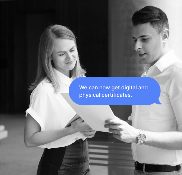 A man and a woman looking at a document in the man's hand